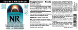 Source Naturals cápsula junto a una moneda para comparar tamaño y dosificación