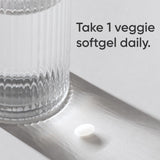 Sports Research gota de aceite de coco orgánico junto a softgel, enfatizando pureza