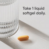 Sports Research softgel en mano para comparar tamaño y dosificación
