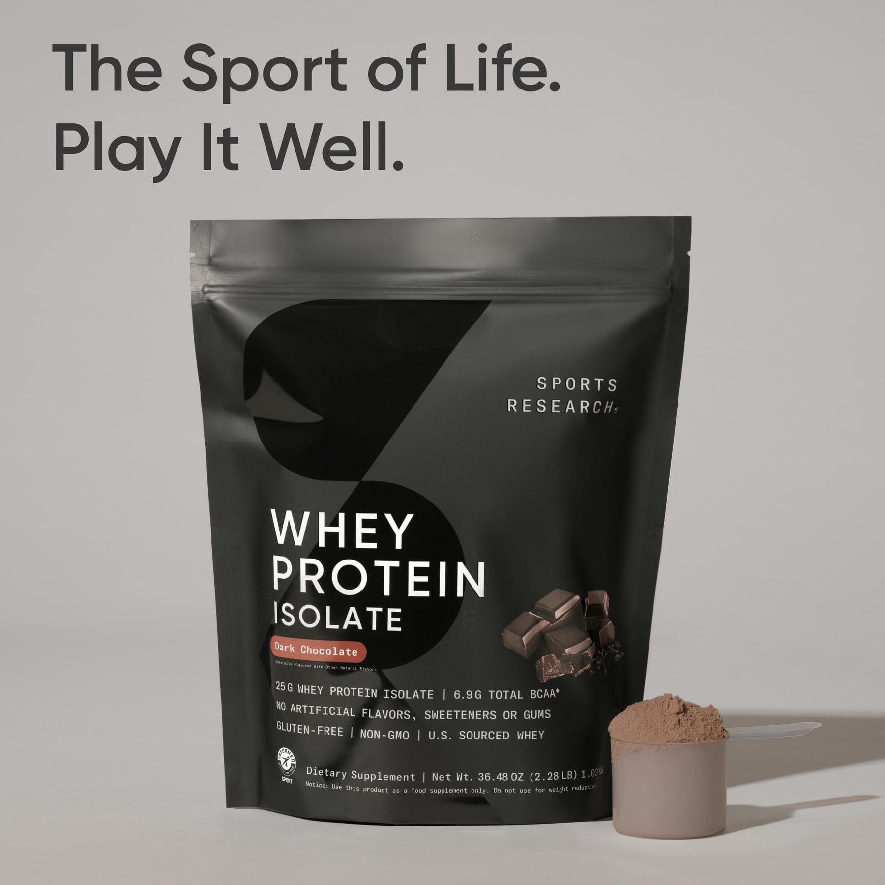 Sports Research bolsa de 2 lb junto a una mancuerna para referencia de tamaño