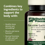 Standard Process Inc. tableta en mano para comparar escala y dosis
