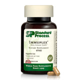 Standard Process frasco delantero de Immuplex mostrando dosis y beneficios