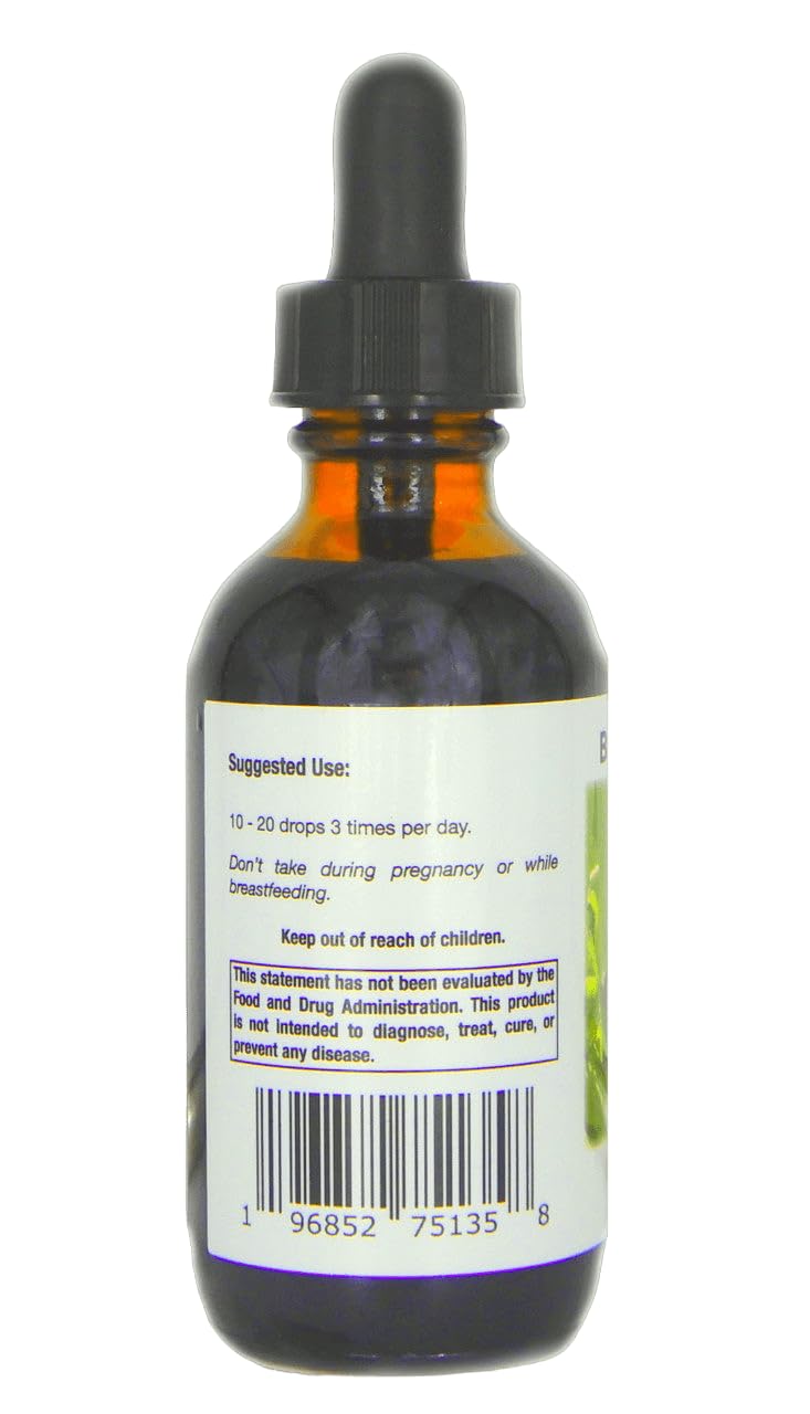 Supreme Nutrition gotas de tintura en un vaso mezclado con agua