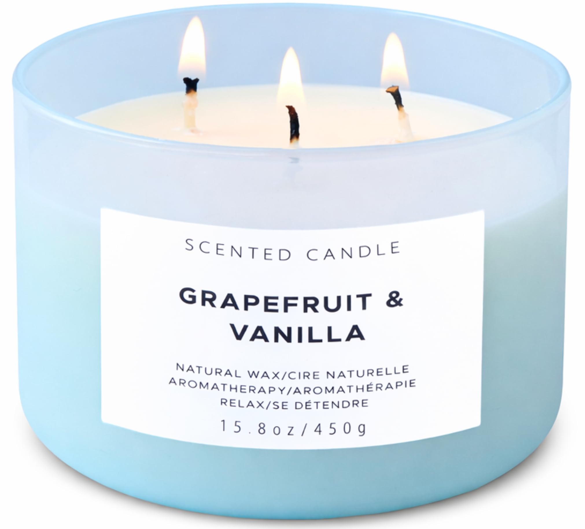 T&H vela Grapefruit Vanilla frontal en vaso azul, aporta elegancia y aroma