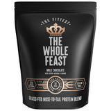 The Fittest envase frontal Whole Feast mostrando etiqueta y beneficio proteico