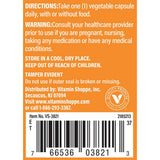The Vitamin Shoppe cápsula en mano para comparar tamaño y conveniencia diaria