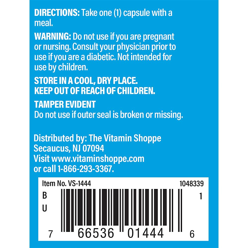 The Vitamin Shoppe cápsula en mano para comparar tamaño y dosificación diaria