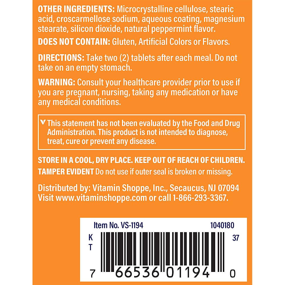 The Vitamin Shoppe tabletas junto a plato para uso durante las comidas