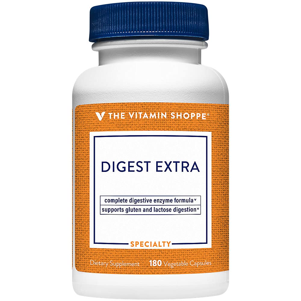 The Vitamin Shoppe frasco en cocina junto a alimentos para contexto diario