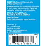 The Vitamin Shoppe frasco junto a un vaso de agua en contexto de uso diario