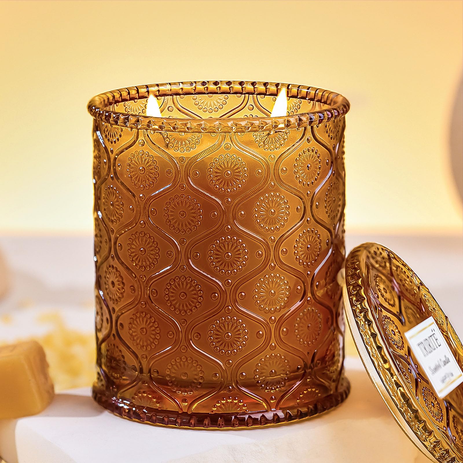 TRIRITE vela en vaso frontal mostrando diseño y vidrio reutilizable