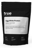 True Nutrition envase frontal Vainilla Francesa, muestra clara y beneficio puro