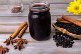 U.S. Wellness Naturals comparación de tamaño de las bayas junto a una mano