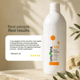 Univera km junto a objetos para comparar tamaño y presentación de 32 fl oz