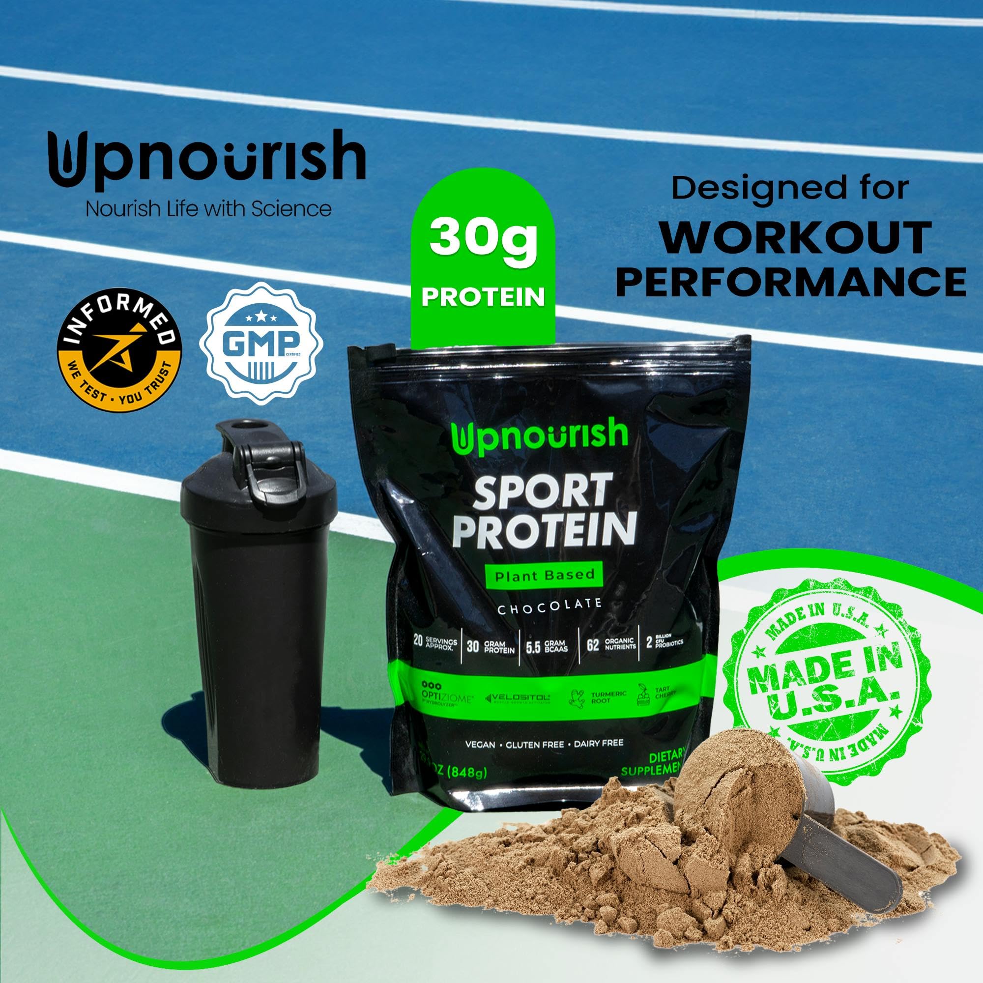 Cuchara con polvo de UpNourish mostrando textura fina y sabor a cacao cremoso