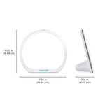 Verilux HappyLight Alba junto a un libro para comparar tamaño y portabilidad