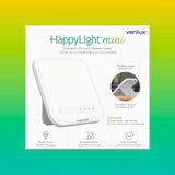 Verilux HappyLight Mini dentro de maleta destacando portabilidad y uso en viaje