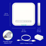 Verilux HappyLight Mini junto a teléfono para comparar tamaño y facilidad de viaje