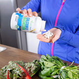 Vitalité Now! estilo de vida activo con envase junto a zapatillas deportivas