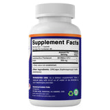 Vitamatic cápsula junto a moneda para comparar tamaño real