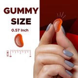 Vitamatic gominola en la mano para comparar tamaño y porción