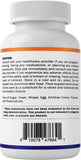 Vitamatic tableta junto a moneda para comparar tamaño real