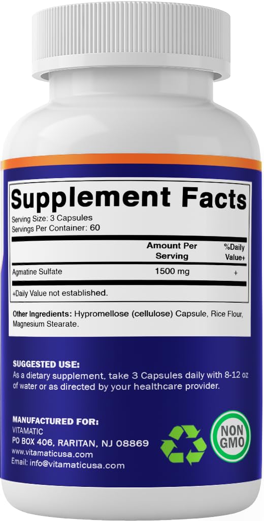 Vitamatic cápsulas sobre mesa junto a vaso de agua indicando uso diario práctico