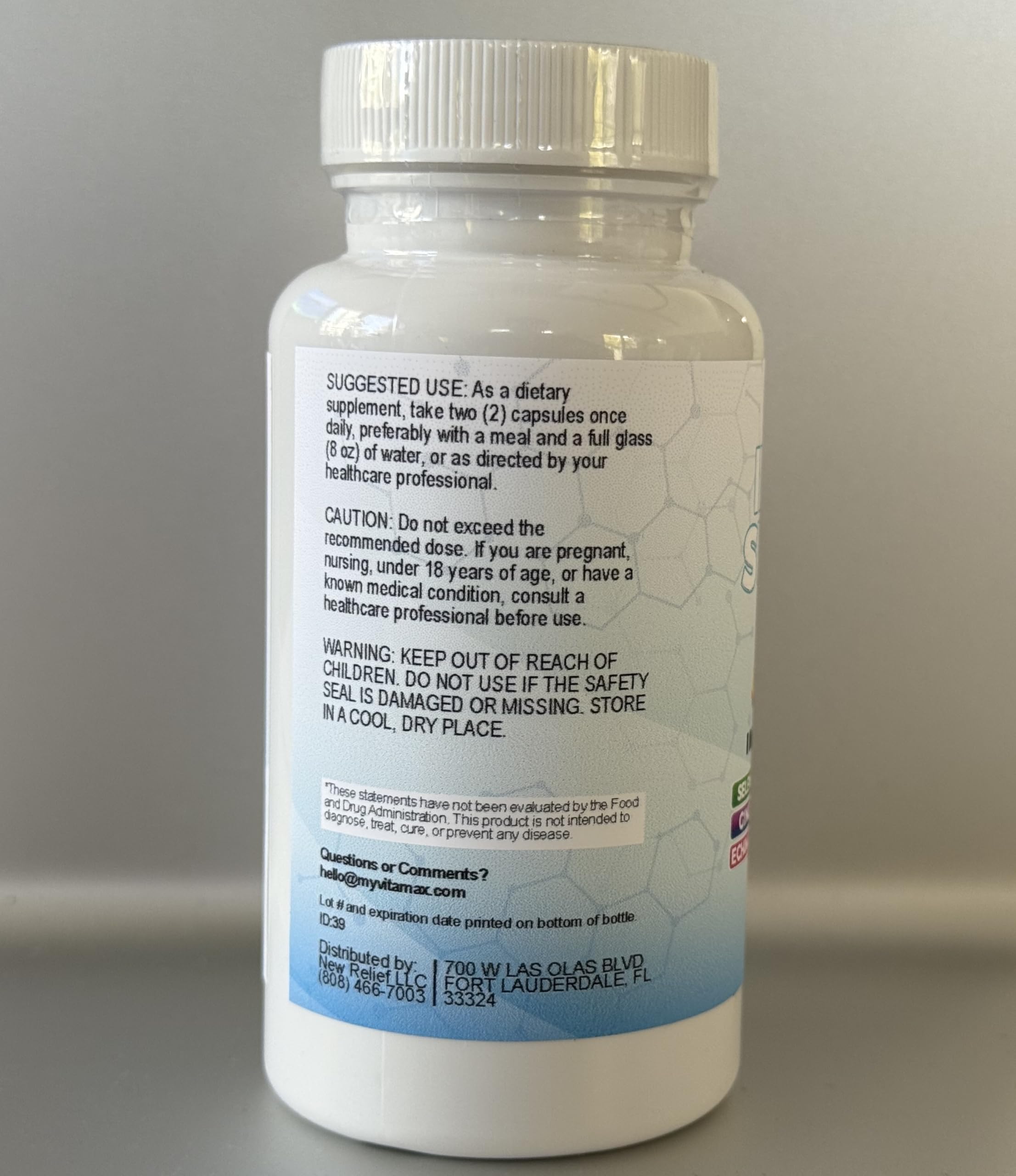 Vitamax botella abierta con cápsulas para fácil toma diaria