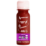 Vive Organic shot en mesa de desayuno junto a frutas, integración diaria fácil