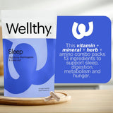 Wellthy frasco en mesa de noche junto a vela para uso nocturno relajante