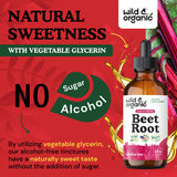 Wild & Organic botella abierta con gota en cuchara, muestra la dosificación simple y sin alcohol