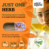 Wild & Organic cápsulas junto a monedas para mostrar tamaño y porción