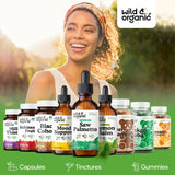 Wild & Organic botella junto a una regla para comparar el tamaño portátil