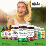 Wild & Organic cápsulas junto a moneda para comparar tamaño real
