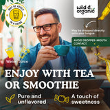 Wild & Organic gotas mezcladas en vaso de agua para uso diario