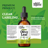 Wild & Organic hojas de olivo frescas junto al frasco evidenciando origen vegetal