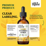 Wild & Organic tintura sobre mesa de madera representando uso cotidiano