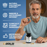 X Gold Health cápsulas en mano para comparar tamaño y dosificación