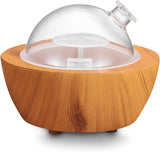 XANAPHIA vista frontal con cubierta de cristal y base efecto madera beneficiando decoración