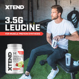 Xtend envase al lado de una mano mostrando tamaño y 90 servicios