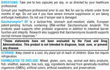 XYMOGEN cápsulas junto a moneda para comparar tamaño y dosificación visual