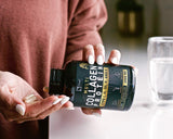 Zeal Naturals cápsula junto a moneda para comparar tamaño práctico